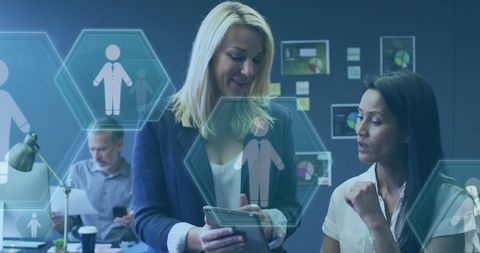 Business Women Collaborating with Digital Interface Holograms