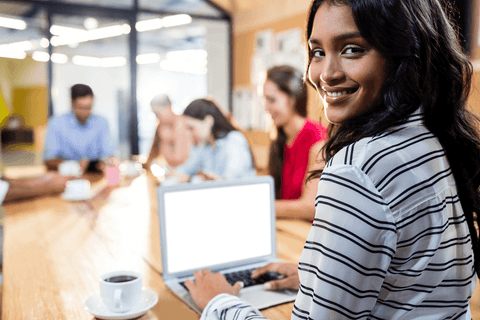 transparent focused businesswoman smiling at office laptop - Download Free Stock Videos Pikwizard.com