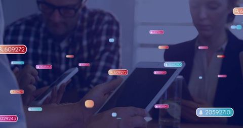 Business Professionals Discussing Analytics with Digital Devices