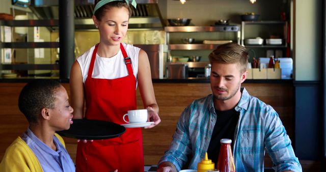 Waitress Serving Coffee to Couple in Cozy Restaurant Interior - Download Free Stock Images Pikwizard.com