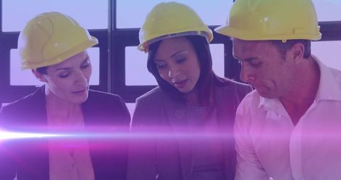 Diverse Engineers Collaborating with Digital Light Effects