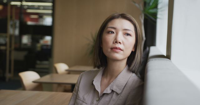 Thoughtful Woman Sitting Alone in Coffee Shop - Download Free Stock Images Pikwizard.com