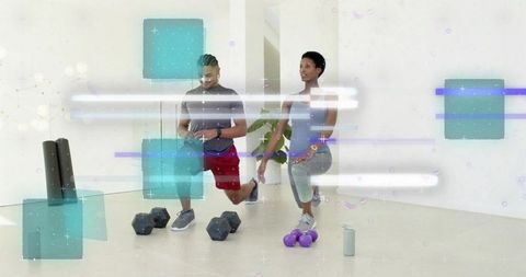 Couple performing forward lunges in modern studio with dumbbells and digital overlays