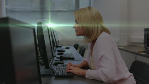 Female Teacher Engaging with Computer Technology