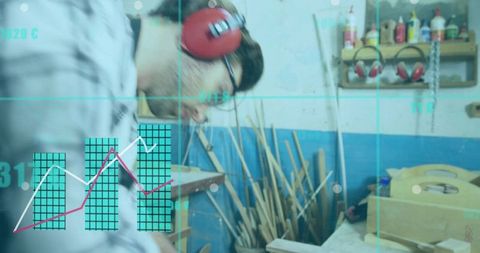 Craftsman examining wooden box at workbench with protective earmuffs and HUD analytics