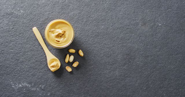 Peanut Butter and Spoon on Gray Stone Background - Download Free Stock Images Pikwizard.com