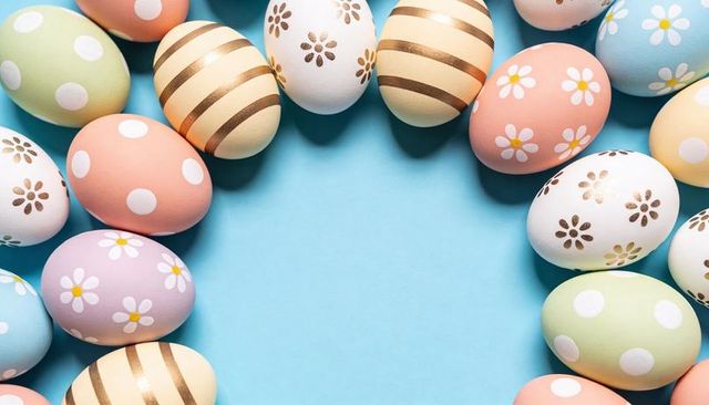 Pastel Easter Egg Wreath with Gold Stripes, Daisy Patterns and Polka Dots on Blue