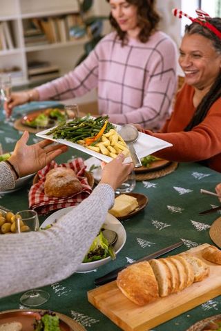 Joyful Family Sharing Festive Meal at Holiday Dinner