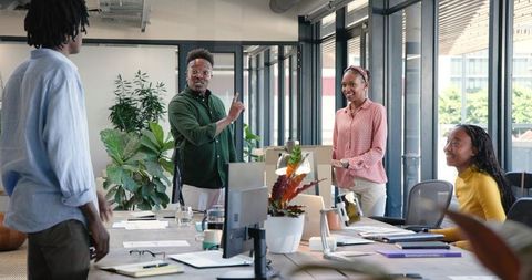 Creative Team Discussing Ideas in Modern Office