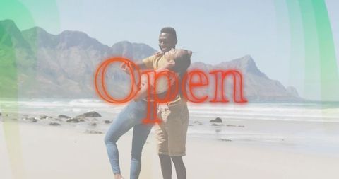 Couple hugging and laughing on sunny beach with red open overlay