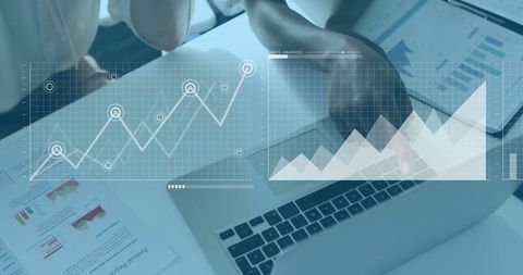 Business Women Analyzing Financial Data with Digital Graphs