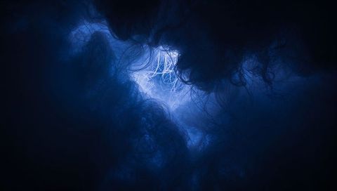 Backlit blue filament nebula with wispy tendrils abstract macro fiber cluster