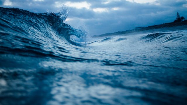 Big Blue Wave Crashing at Sunset in Ocean - Download Free Stock Photos Pikwizard.com