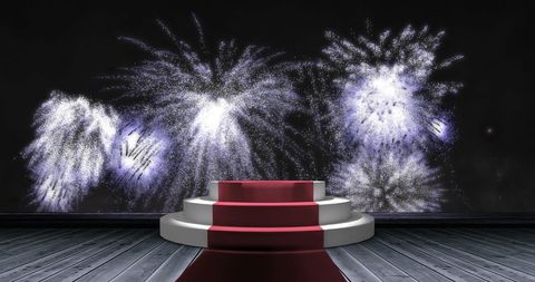 White fireworks over steps at red carpet event