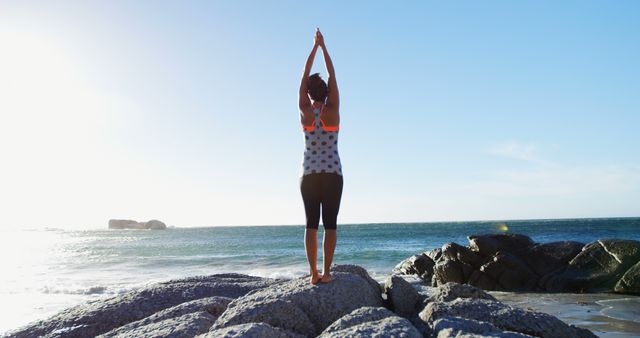 Woman Practicing Yoga on Rocky Beach During Sunrise - Download Free Stock Images Pikwizard.com