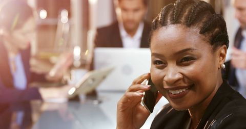 Confident Businesswoman Engaged in Office Phone Call - Download Free Stock Images Pikwizard.com