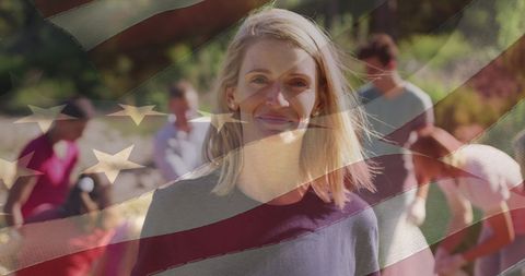Smiling Female Volunteer with American Flag in Background