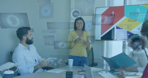 Diverse Team Analyzing Data with Augmented Reality in Office