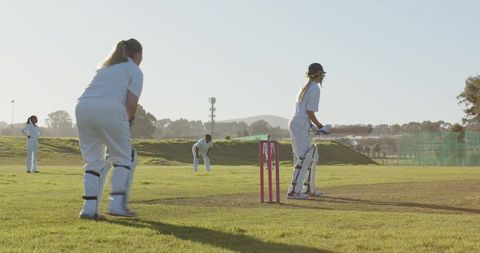 Women Engaged in Cricket Match on Sunny Day - Download Free Stock Images Pikwizard.com