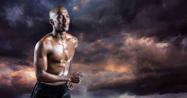 Muscular male athlete running against a backdrop of dark, dramatic clouds, illustrating themes of fitness and determination. This image is ideal for promoting sportswear, fitness programs, motivational campaigns, and inspirational content. It highlights the enduring perseverance required for athletic success.