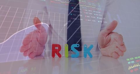 Businessman analyzing risk with financial charts and data
