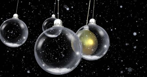 Elegant Glass Baubles Hanging with Snowflakes and Golden Glow