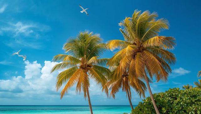 Swaying coconut palms over turquoise ocean with seagulls gliding for tropical escape