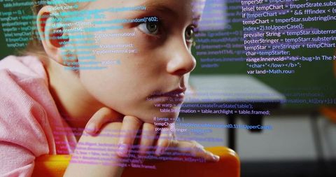 Schoolgirl leaning on desk studying code with digital programming overlay
