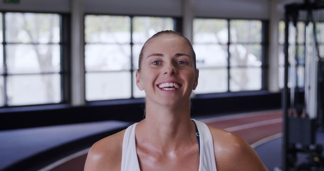 Healthy Young Woman Smiling in Indoor Gym - Download Free Stock Images Pikwizard.com