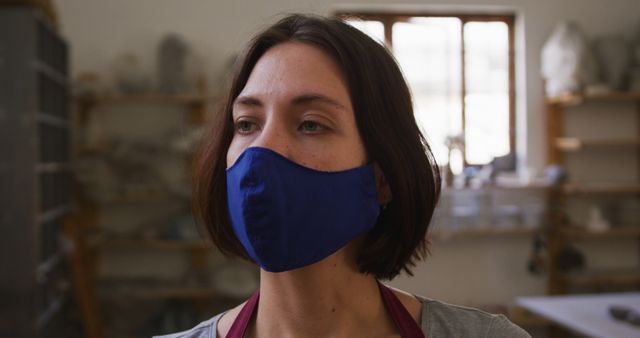 Woman Wearing Face Mask in Art Studio - Download Free Stock Images Pikwizard.com