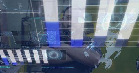 Man standing with crossed arms behind futuristic holographic hud analytics display