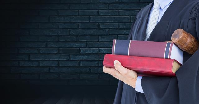 Judge holds law books and gavel against dark brick wall. Perfect for legal blogs, law firm websites, courtroom illustrations, justice system education materials.