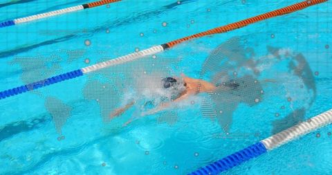 Competitive Swimmer Powering Through Lane Splashes with Digital World Map Overlay