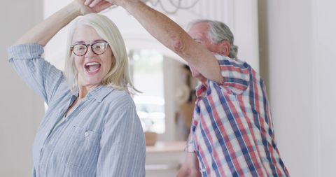 Happy Senior Couple Dancing Playfully at Home - Download Free Stock Images Pikwizard.com