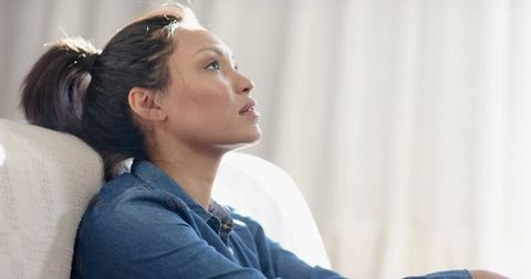 Calm Woman In Denim Shirt Reflecting Leisurely By Window