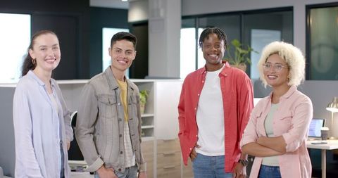 Diverse Team of Colleagues Collaborating in Modern Office