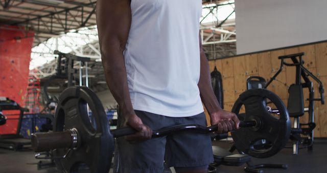 Close-Up of Athlete Lifting Weights in Gym - Download Free Stock Images Pikwizard.com