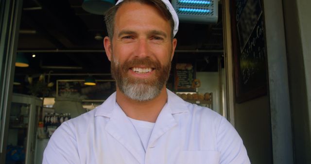 Male Chef in Restaurant Uniform Smiling Confidently - Download Free Stock Images Pikwizard.com