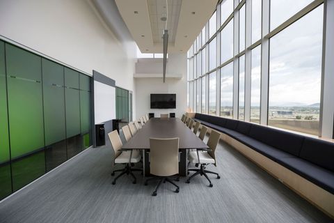 Modern Conference Room with Large Window and Office Chairs