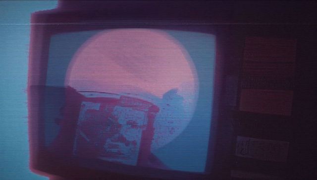 Retro Smartphone Silhouette Over Full Moon on Vintage Display