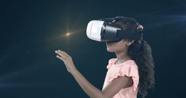 African American girl exploring a virtual world using a VR headset. Ideal for educational technology promotions, future tech presentations, children's digital learning, and gaming industry advertisements.