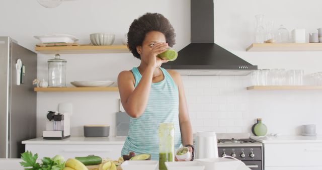 Healthy African American Woman Drinking Green Smoothie in Modern Kitchen - Download Free Stock Images Pikwizard.com