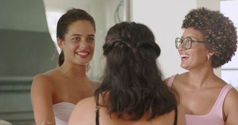 Joyful Women Sharing Laughter and Bonding Indoors
