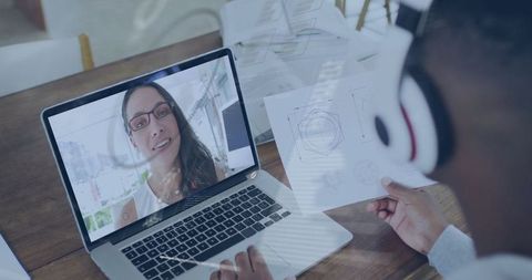 Engineer Participating in Virtual Meeting Reviewing Technical Diagrams