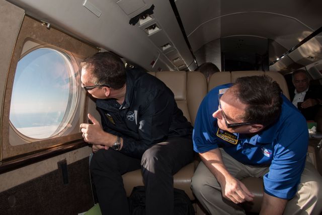 Robert Lightfoot, acting NASA administrator and Thomas Zurbuchen NASA AA for the science mission directorate view a partial eclipse solar eclipse Monday, August 21, 2017, from onboard a NASA Armstrong Flight Research Center’s Gulfstream III 35,000 feet above the Oregon Coast. A total solar eclipse swept across a narrow portion of the contiguous United States from Lincoln Beach, Oregon to Charleston, South Carolina. Photo Credit: (NASA/Carla Thomas)