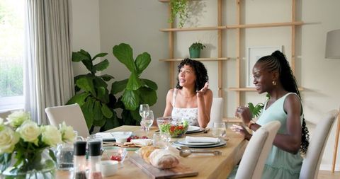 Friends Celebrating Together at Home Dining Table