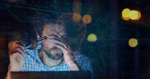 Stressed man contemplating next big idea over illumination