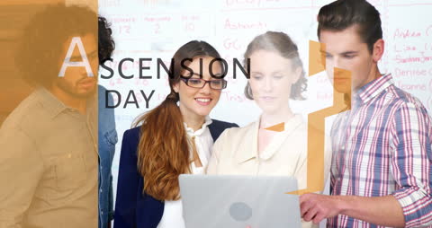 Diverse Team Collaborating on Laptop in Modern Workplace