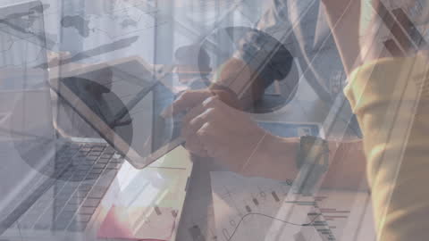 Business Team Analyzing Data on Digital Tablet