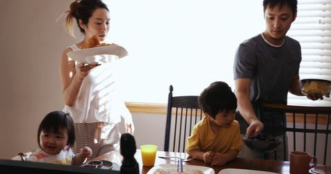 Family Enjoying Breakfast in Cozy Dining Room
